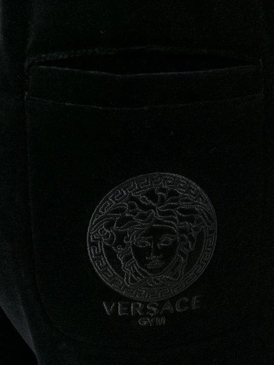 Shop Versace Velvet Track Pants In Black