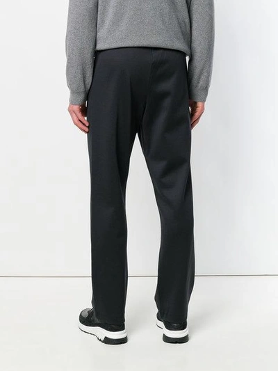 Shop Valentino Rockstud Trousers In Black