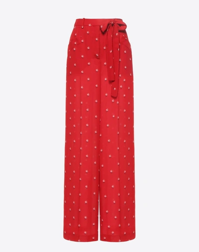 Shop Valentino Rosebud Print Pants In Red