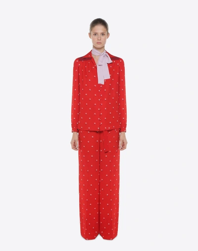 Shop Valentino Rosebud Print Pants In Red