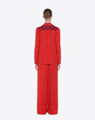 Shop Valentino Rosebud Print Pants In Red