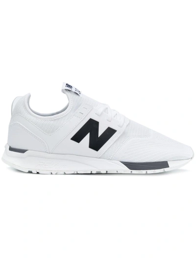 Shop New Balance 247 Sneakers - White