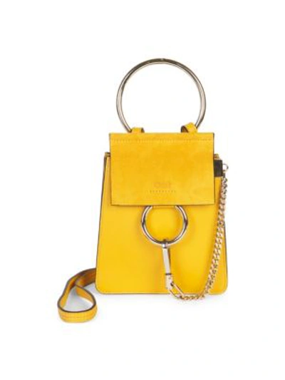 Shop Chloé Mini Faye Leather Bracelet Bag In Yellow