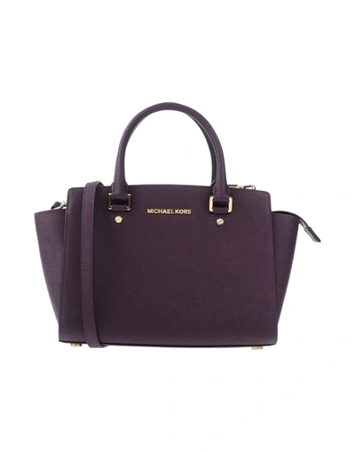 Shop Michael Michael Kors Handbag In Purple