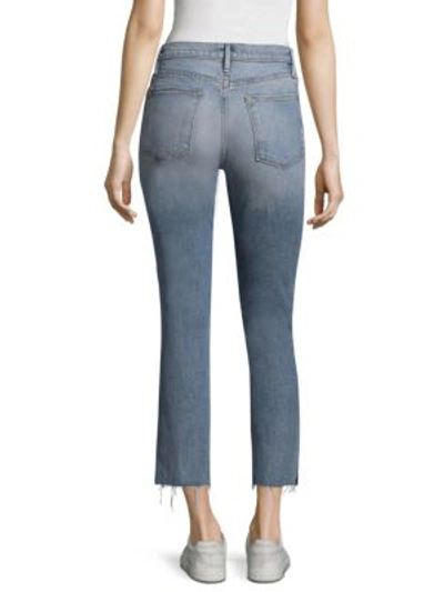 Shop Frame Light Wash Straight Leg Slit Rivet Hem Jeans In Surrey