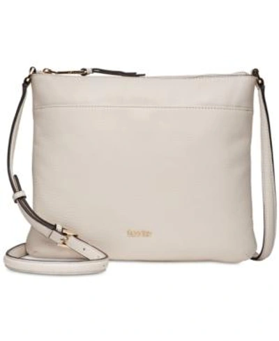Shop Calvin Klein Pebble Leather Lily Crossbody In White/gold