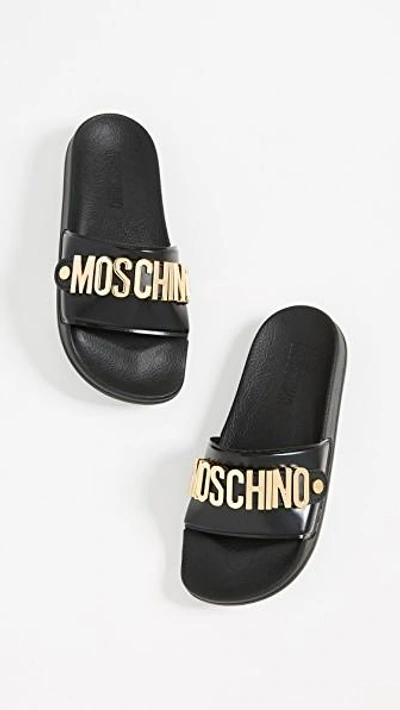 Shop Moschino Logo Sandals In Black/gold