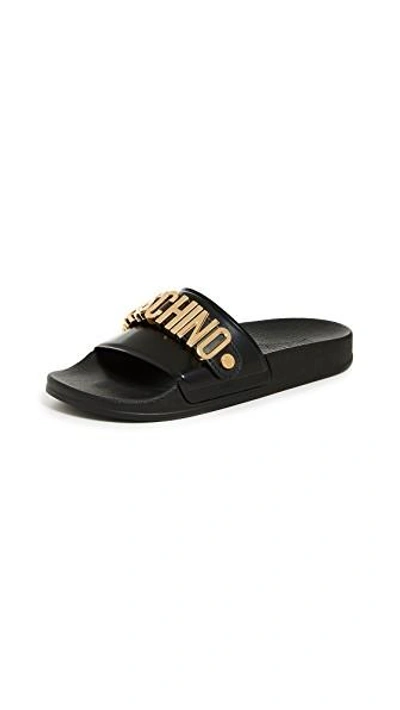 Shop Moschino Logo Sandals In Black/gold