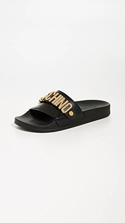 Shop Moschino Logo Sandals In Black/gold