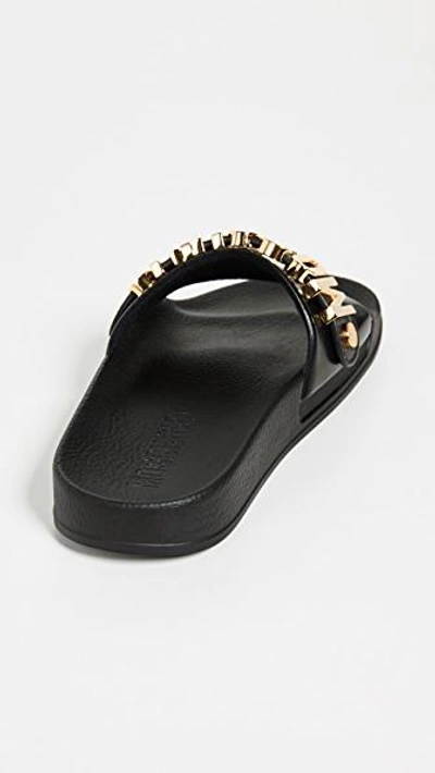 Shop Moschino Logo Sandals In Black/gold
