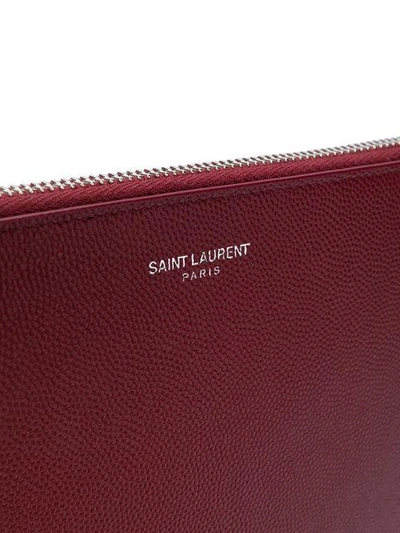 Shop Saint Laurent Logo Embossed Clutch In Red