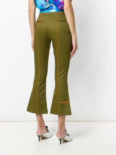 Shop Msgm Cropped Flare Trousers In Green
