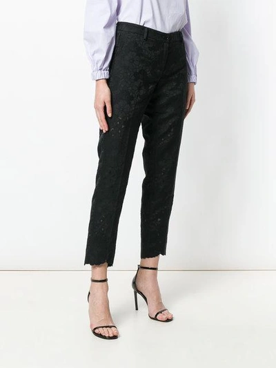 Shop Michael Michael Kors Floral Pattern Cropped Trousers In Black