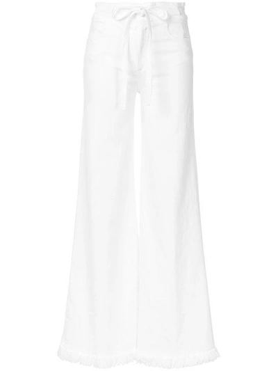 Shop Frame Distressed High-rise Flared Jeans In White