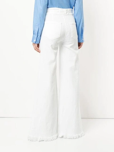 Shop Frame Distressed High-rise Flared Jeans In White