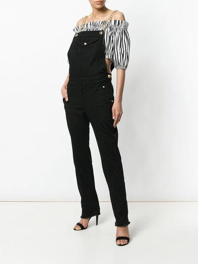 Shop Balmain Chain-trimmed Denim Overalls - Black