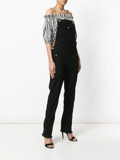 Shop Balmain Chain-trimmed Denim Overalls - Black