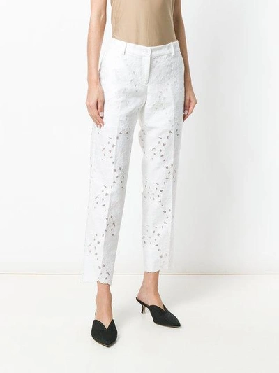 Shop Michael Michael Kors Floral-pattern Cropped Trousers In White