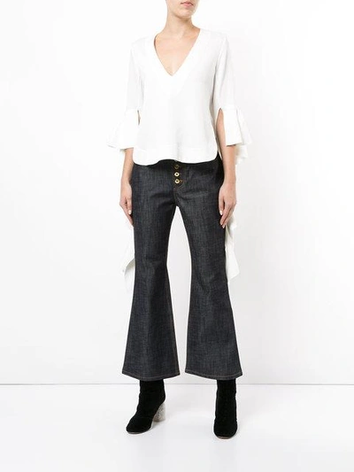 Shop Ellery Pyramid Crop Kick Flare Jeans - Navy Raw