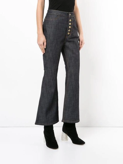 Shop Ellery Pyramid Crop Kick Flare Jeans - Navy Raw