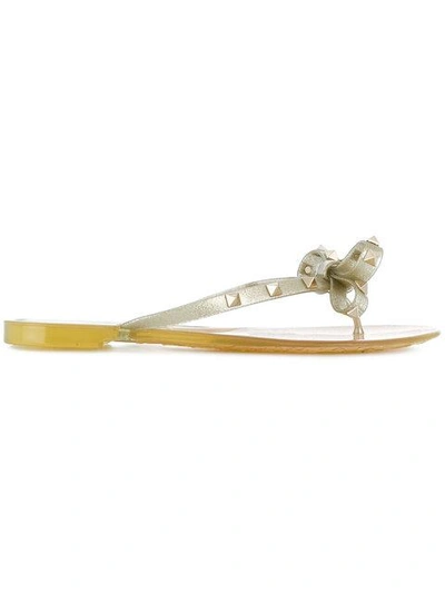 Shop Valentino Rockstud Bow Flip Flops In Neutrals