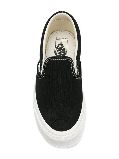 Shop Vans Classic Slip-on Sneakers - Black