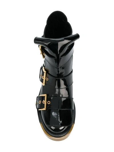 Shop Alexander Mcqueen Buckle Fastening Boots In Black