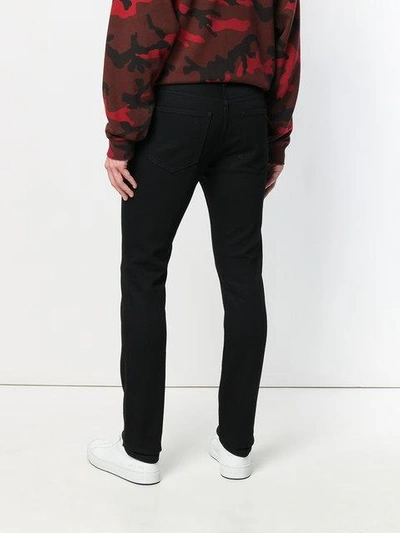 Shop Valentino Stretch Skinny Trousers In Black