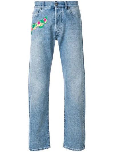 Shop Versace Embroidered Detail Jeans In Blue