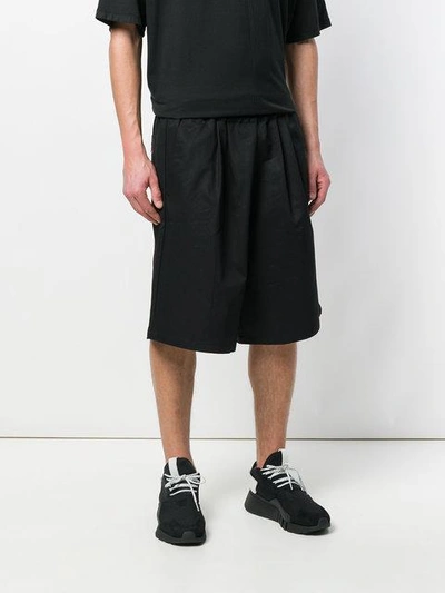 Shop Komakino Flared Track Shorts In Black