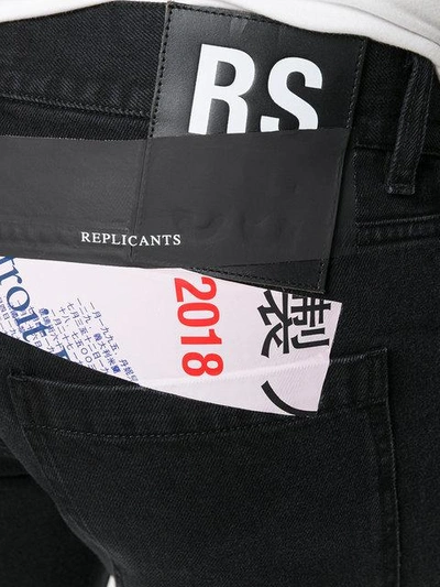Shop Raf Simons Jeans Mit Logo-patch In Black
