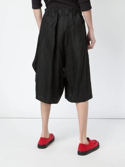 Shop Yohji Yamamoto Asymmetric Front Culottes - Black