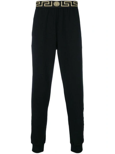 Shop Versace Greca Track Pants In Black