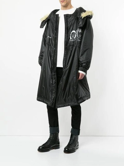 Shop Undercover Oversized Hooded Raincoat In Black