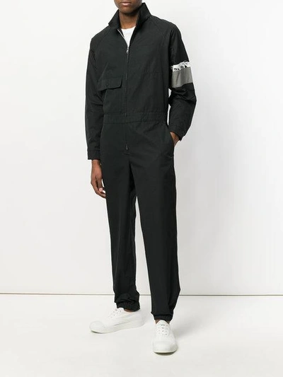 Shop Prada Jumpsuit With Armband Graphic - Black