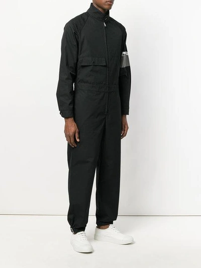 Shop Prada Jumpsuit With Armband Graphic - Black