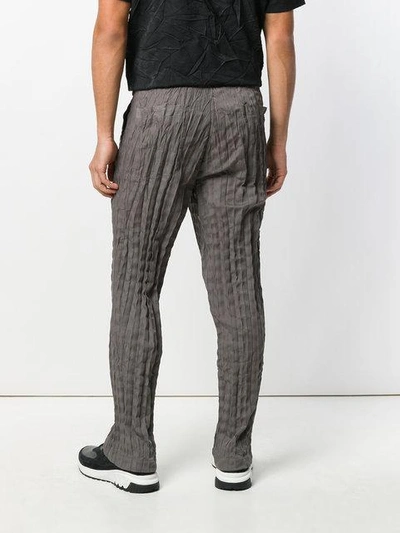 Shop Issey Miyake Torus Crinkled Trousers