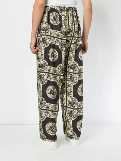 Shop Edward Crutchley Tile Print Trousers - Multicolour