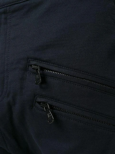 Shop Pierre Balmain Zipped Panelled Trousers - Blue