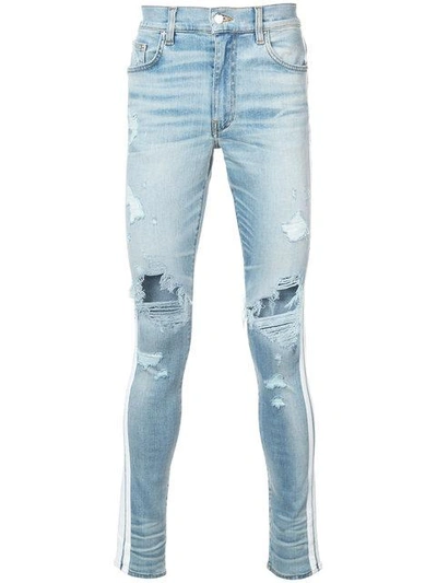Shop Amiri Skinny Track Jeans - Blue
