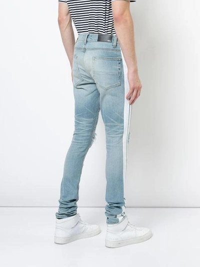 Shop Amiri Skinny Track Jeans - Blue