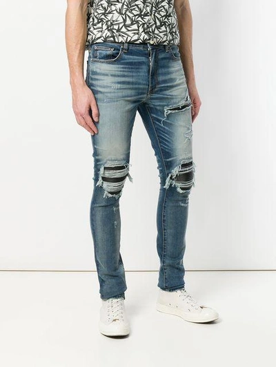Shop Amiri Mx1 Leather Patch Jeans - Blue