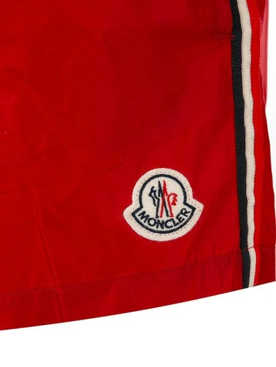 Shop Moncler Side Stripe Swim Shorts In Red