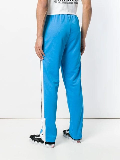 Shop Palm Angels Striped Track Trousers In Blue