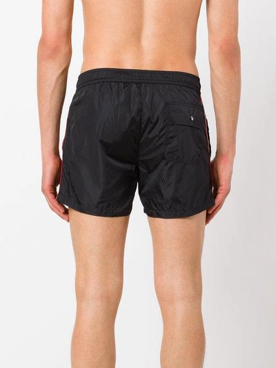 Shop Moncler Striped Trim Swim Shorts In Black