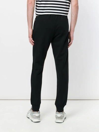 Shop Moschino Logo Tracksuit Bottoms