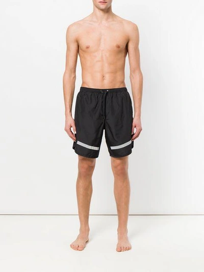 Shop Neil Barrett Stripe Hem Swimming Shorts - Black