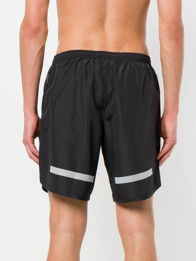 Shop Neil Barrett Stripe Hem Swimming Shorts - Black