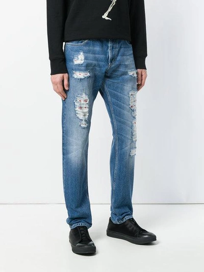 Shop Alexander Mcqueen Distressed Folk Embroidery Jeans In Blue