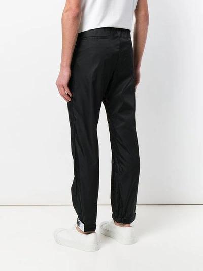 Shop Prada Rubber Tag Track Pants In Black